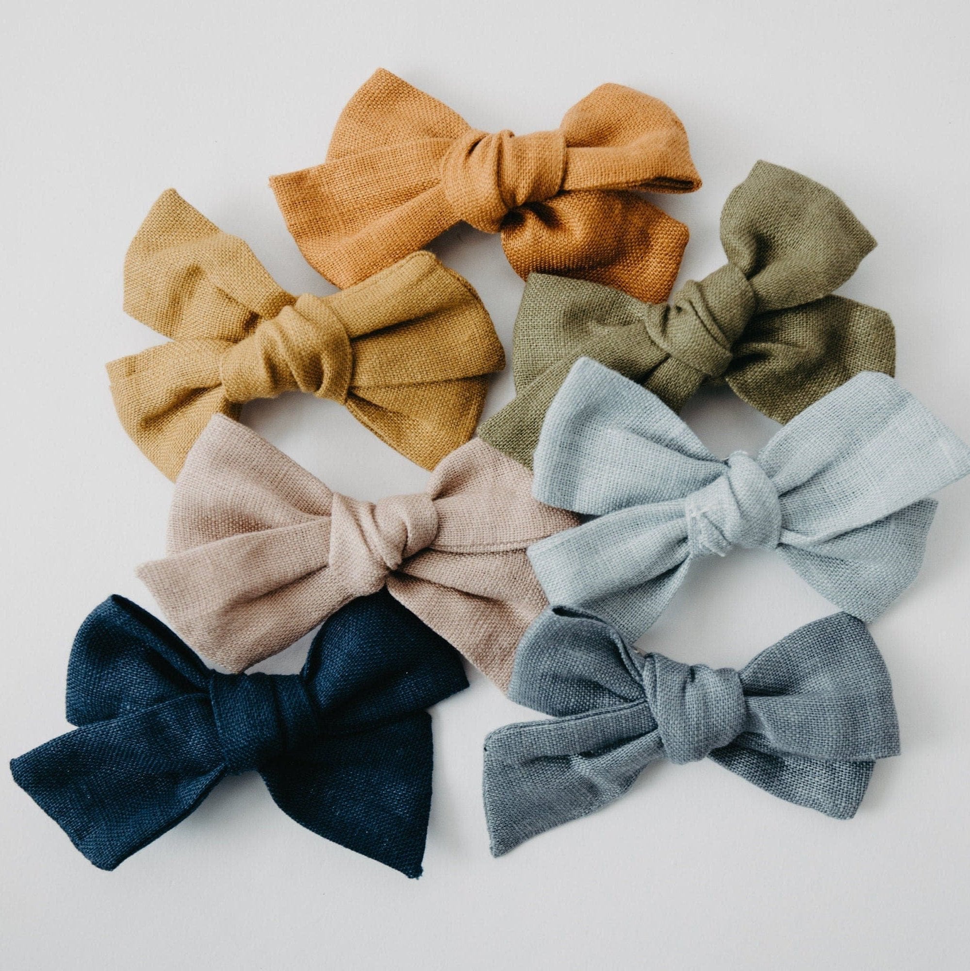 Handmade Linen Bow Hair Clip or Nylon Headband – A stylish, comfortable bow for babies and toddlers. Available in various colors, featuring soft, stretchy nylon bands or alligator clips, perfect for special occasions or everyday wear.