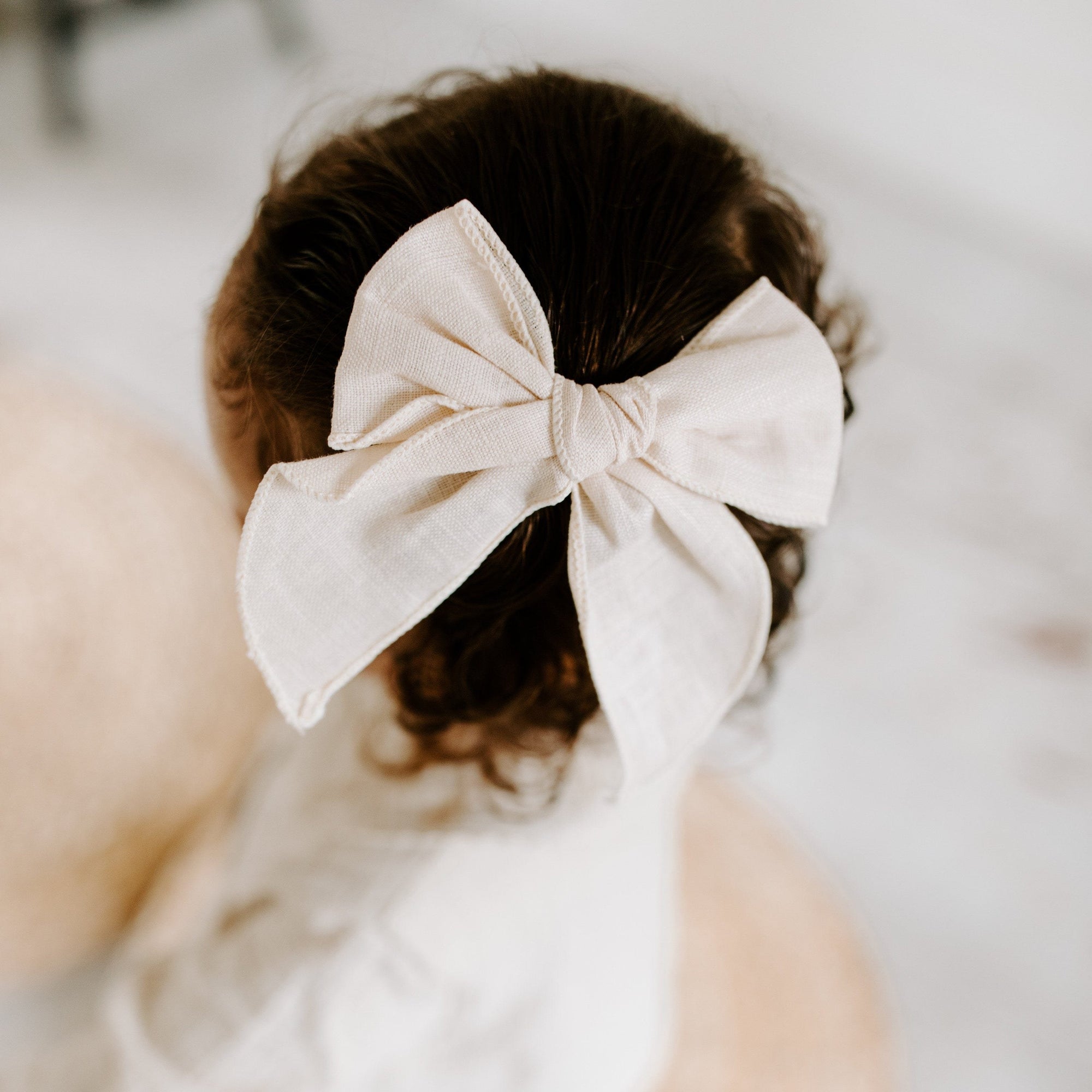 Clay Handmade Linen Bow – A beautifully crafted bow in a warm, earthy clay hue with an alligator clip, perfect for special occasions or daily wear. Made from soft linen and measuring 5.5” x 4.5” for an elegant yet versatile look.