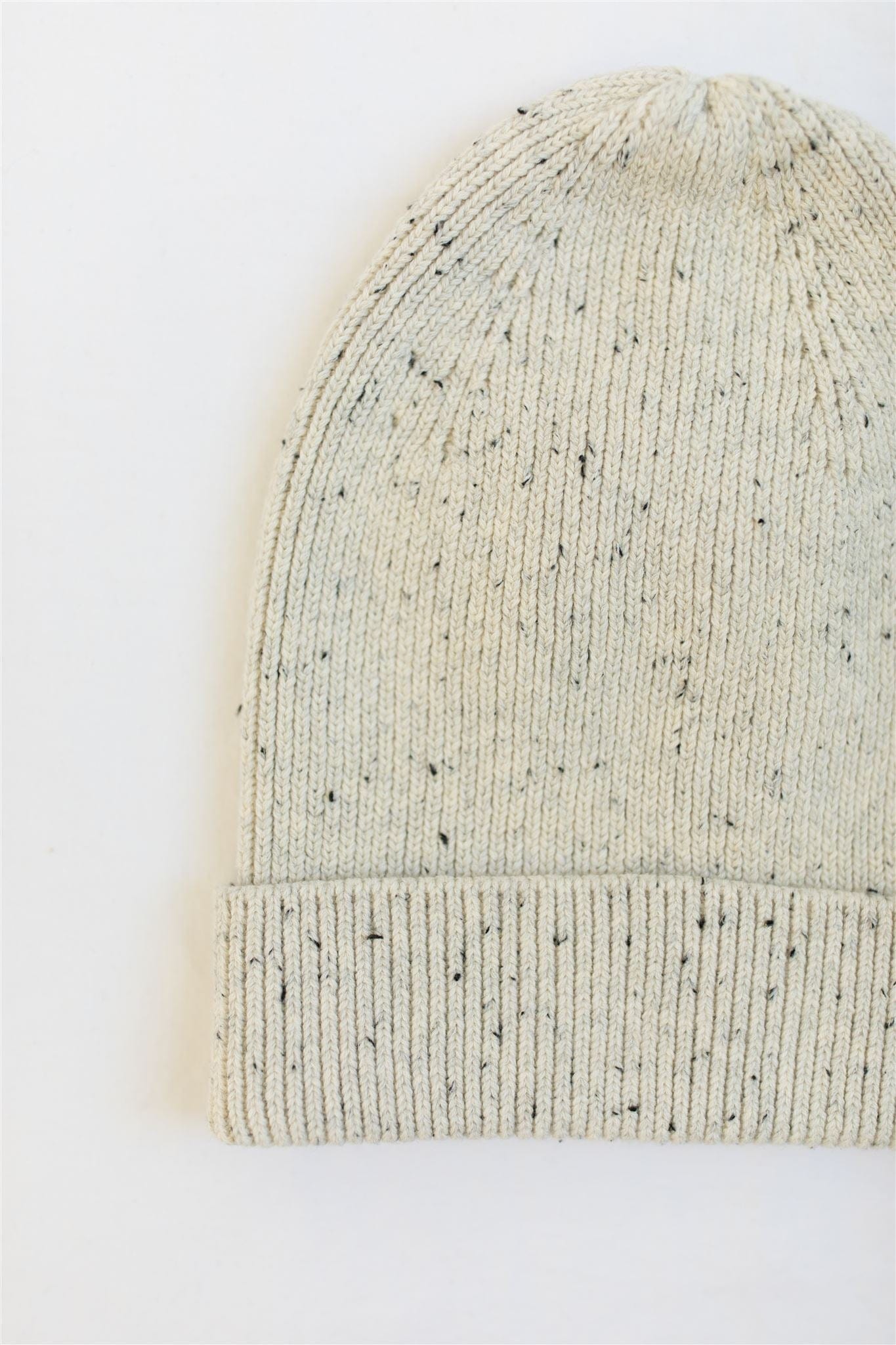 Speckled cotton knit hat for babies, featuring a soft ribbed design in a stylish, gender-neutral color. Ideal for keeping little heads and ears warm during colder months.